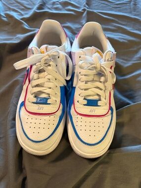 Nike Kids White Sneakers with Blue and Pink Accents